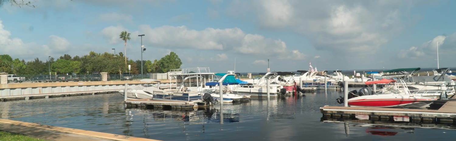Boats docked at the lakefront marina in St. Cloud, Florida
